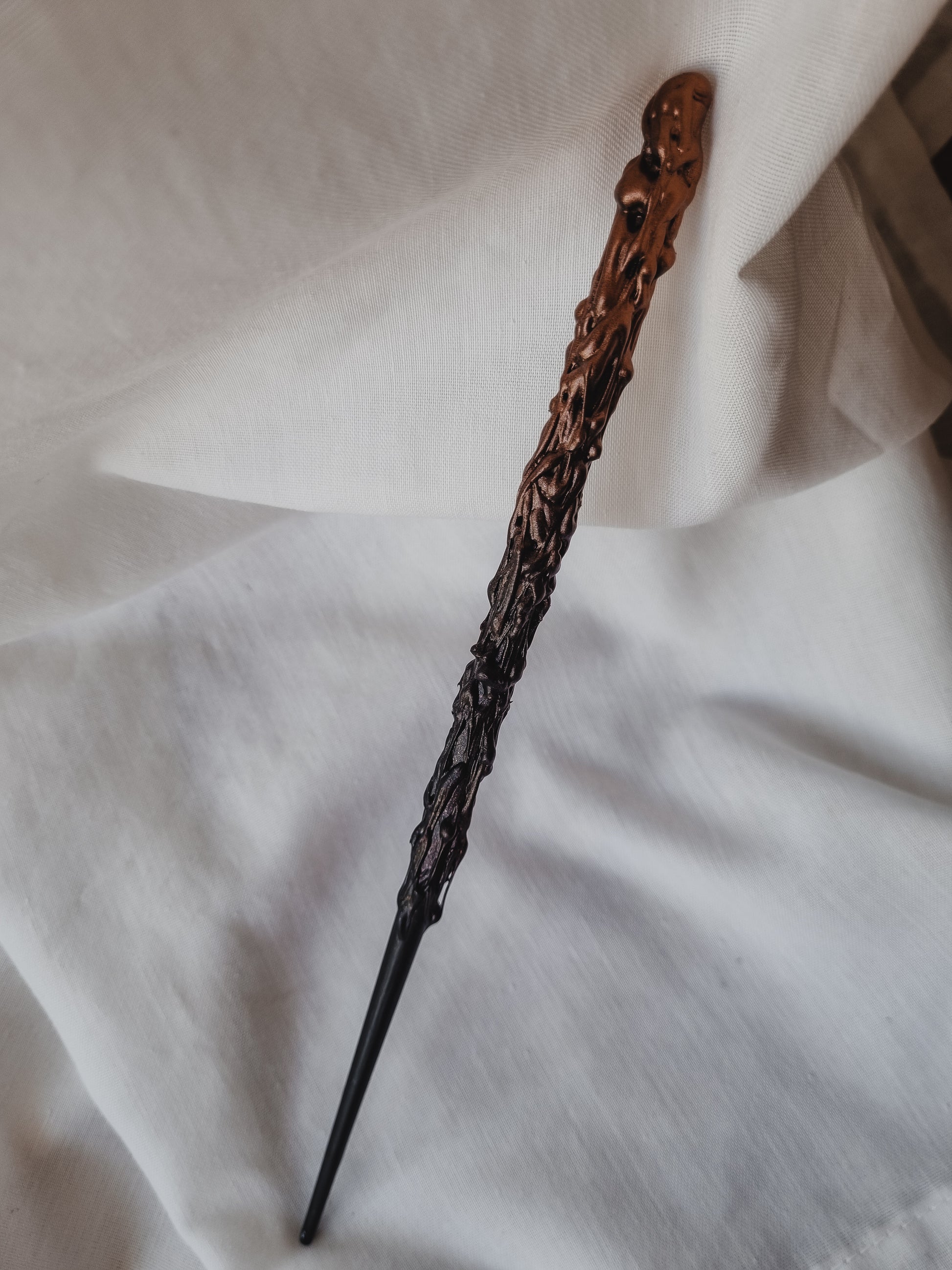 black and gold magical wand