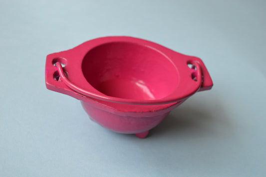 pink cast iron cauldron with handle
